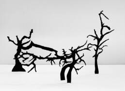 black ink branch forms cut out and displayed as a group of three