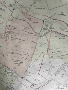 map of site with handwritten field names and text notes, with coloured in areas and boundary lines marked